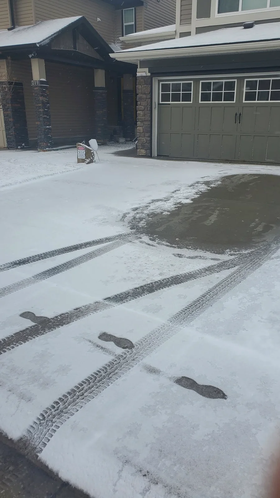 Snow-covered driveway before snow removal