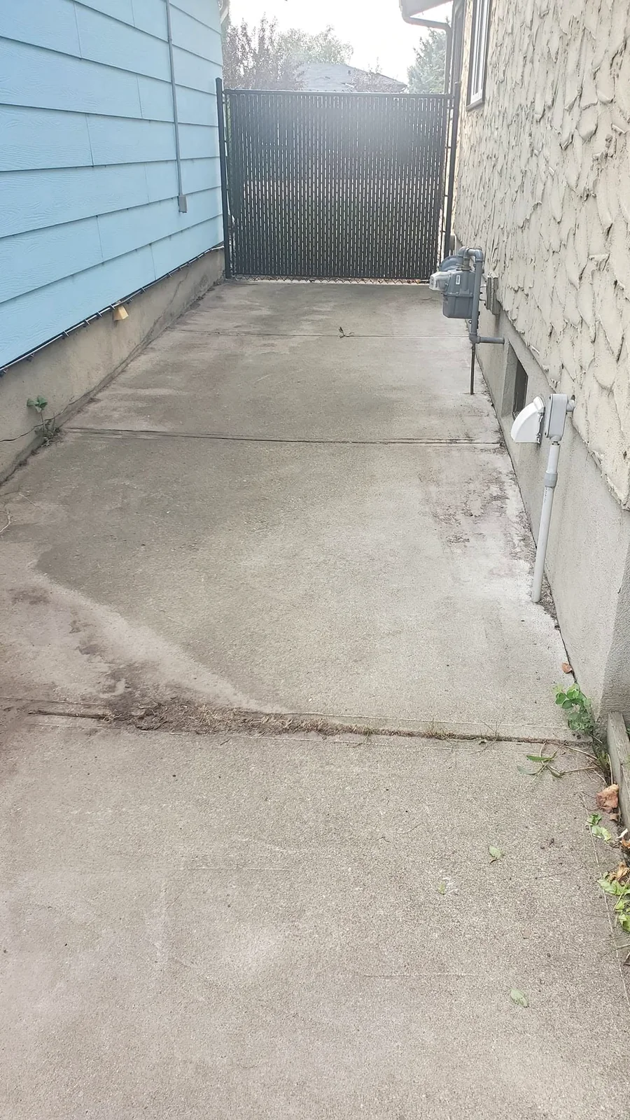 Concrete before pressure washing